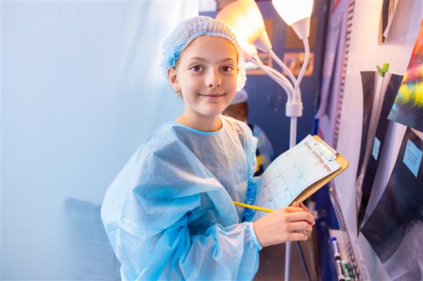 girl with clipboard smiling